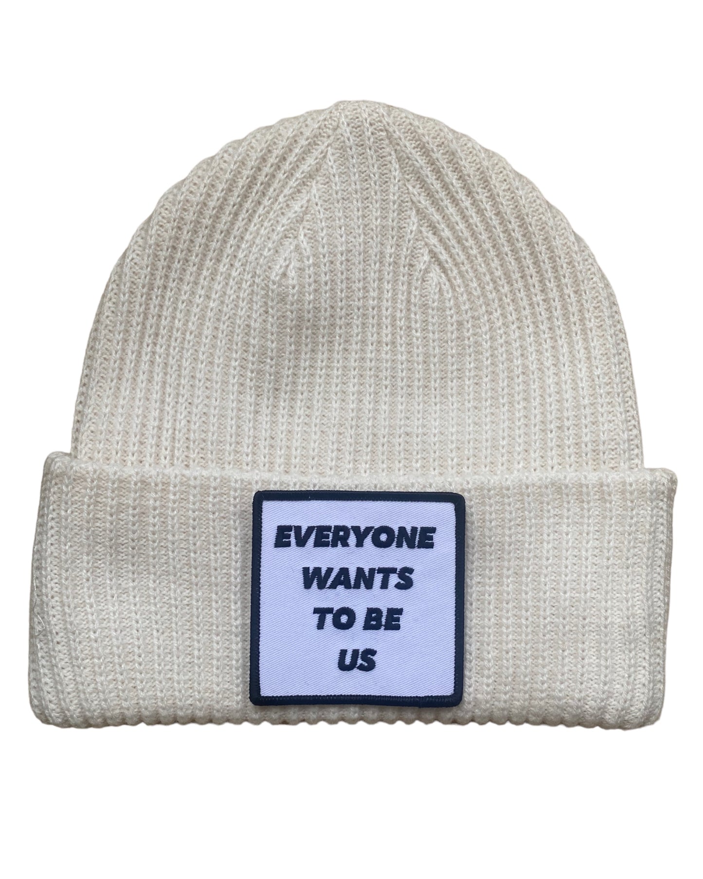 ‘EVERYONE WANTS TO BE US’ Andrea 2.0 cream colored beanie