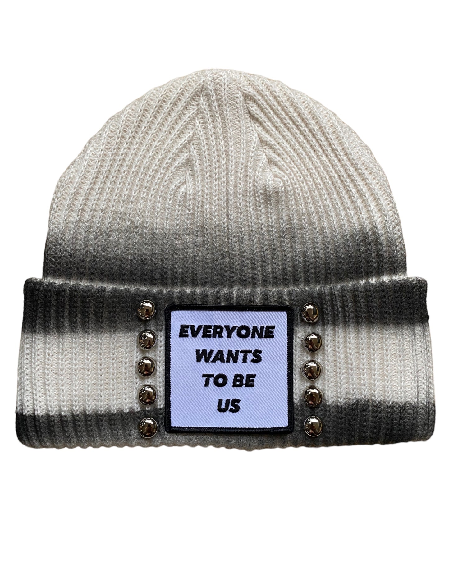 ‘EVERYONE WANTS TO BE US’ Andrea 2.0 street style spray painted cream colored beanie with studs