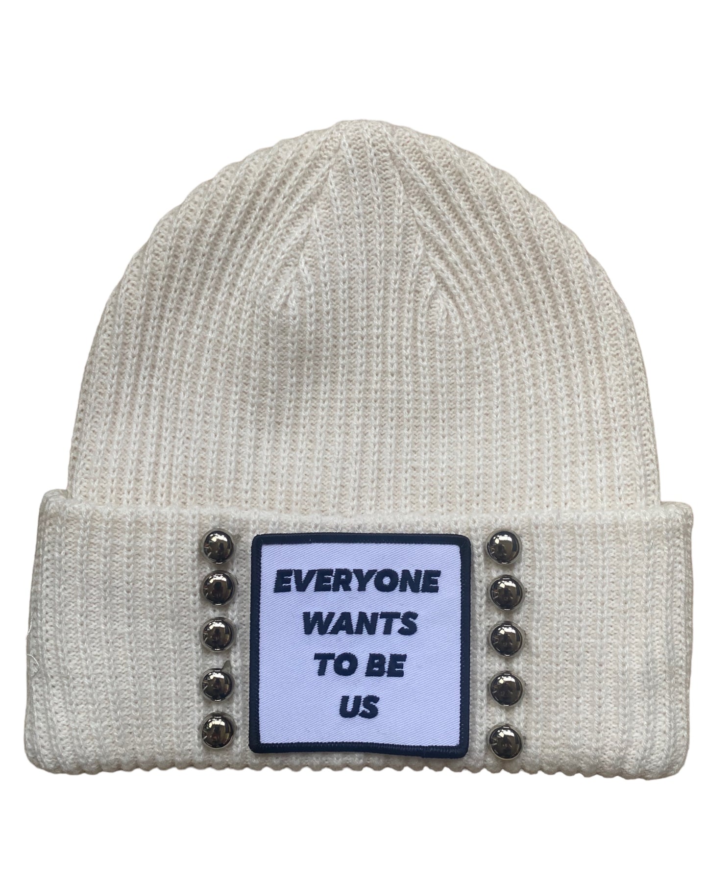 ‘EVERYONE WANTS TO BE US’ Andrea 2.0 cream colored beanie with studs